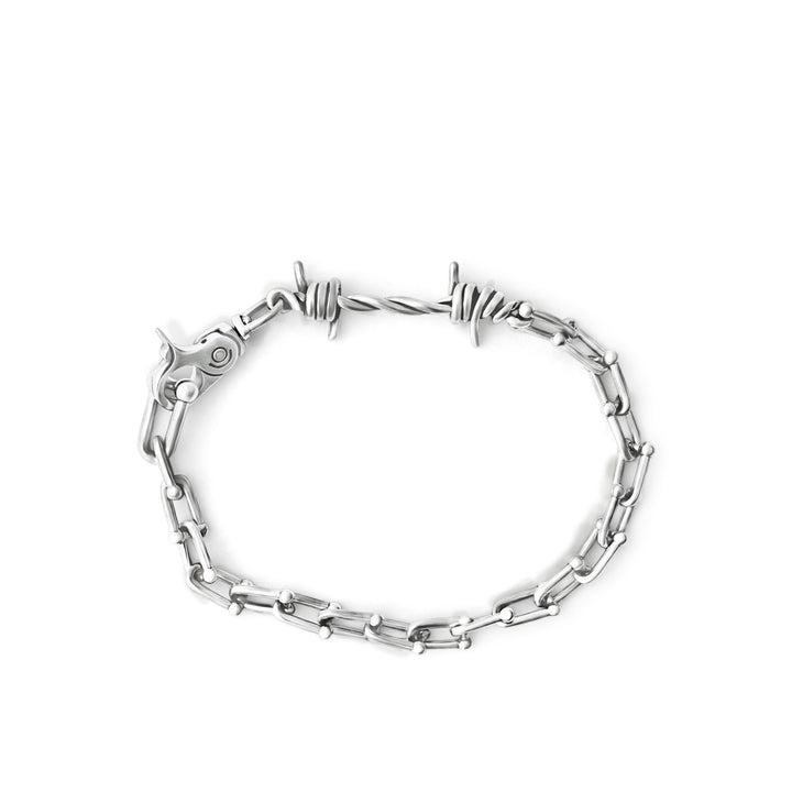 Silver chain bracelet on a white background