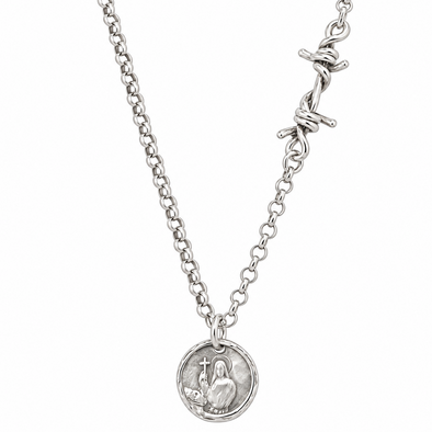 A silver chain necklace featuring a round medallion pendant with a raised figure and a barbed wire clasp closure, shown against a plain white background.
