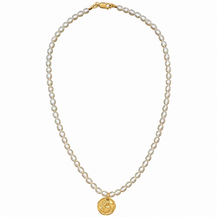 A classic pearl necklace with a gold clasp and a gold circular medallion pendant, displayed on a clean white background.