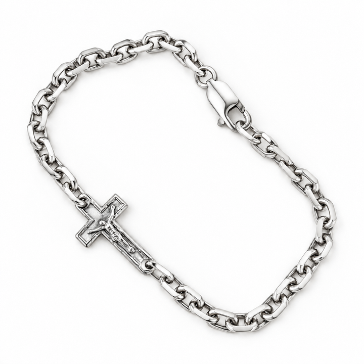 A silver-toned chain bracelet with a crucifix pendant, displayed on a clean white background.