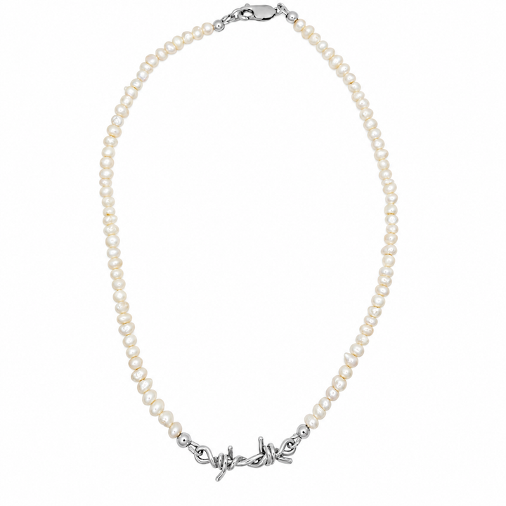 A pearl necklace with a silver-toned decorative clasp, displayed on a clean white background.
