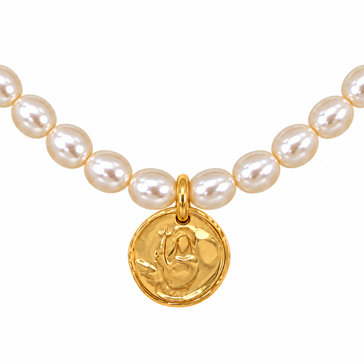 A pearl necklace featuring round, lustrous white pearls and a textured gold pendant medallion, shown against a solid white background.