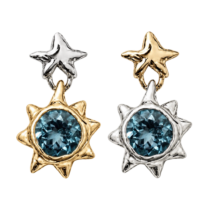 Two pairs of star-shaped dangle earrings on a plain white background. Each earring has a small star at the top in silver or gold-tone metal, connected to a larger sunburst shape with a round blue gemstone in the center.