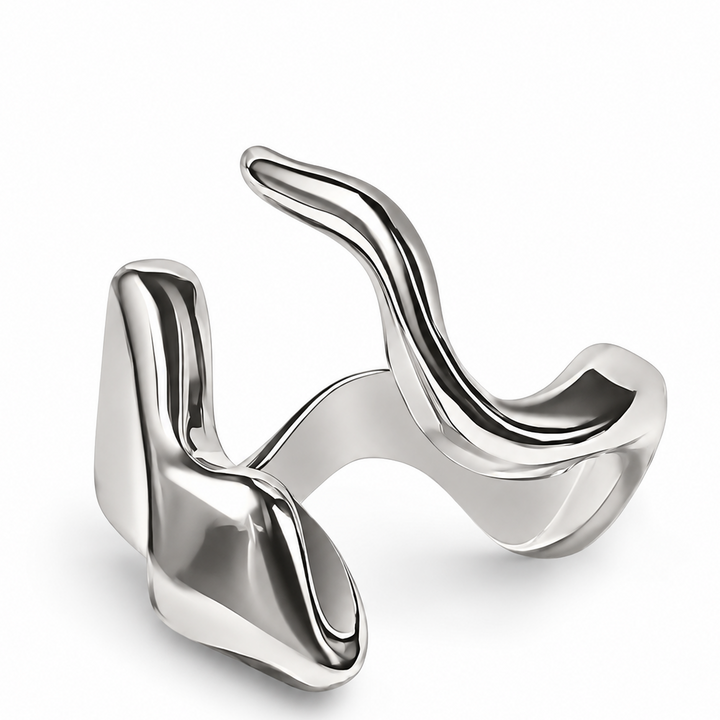 A polished silver abstract ring with a fluid, wavy, organic design, shown on a clean white background.