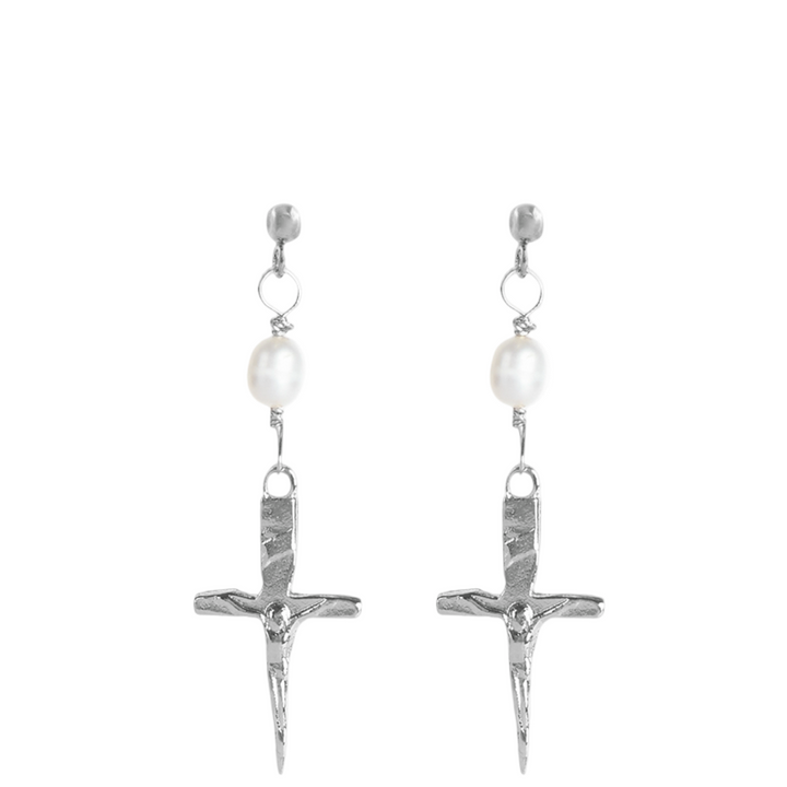 Silver cross earrings with pearl-like beads on a white background