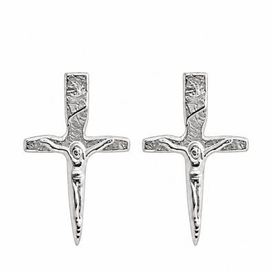 A pair of silver crucifix stud earrings with detailed engravings, shown side-by-side on a plain white background.