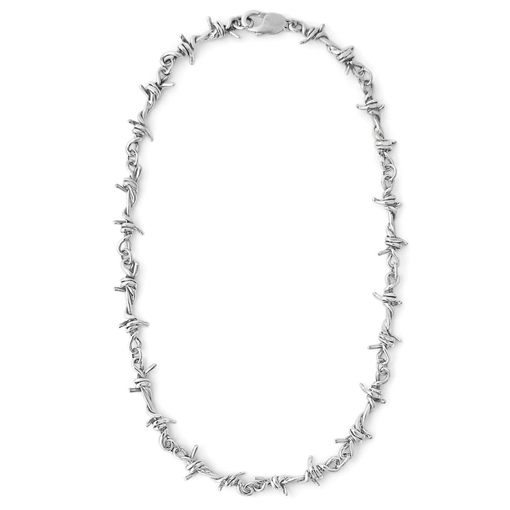 Silver barbed wire necklace on a white background