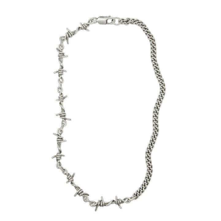 A silver necklace featuring a combination of smooth curb chain links and barbed wire links, with a Lobster Clasp closure.