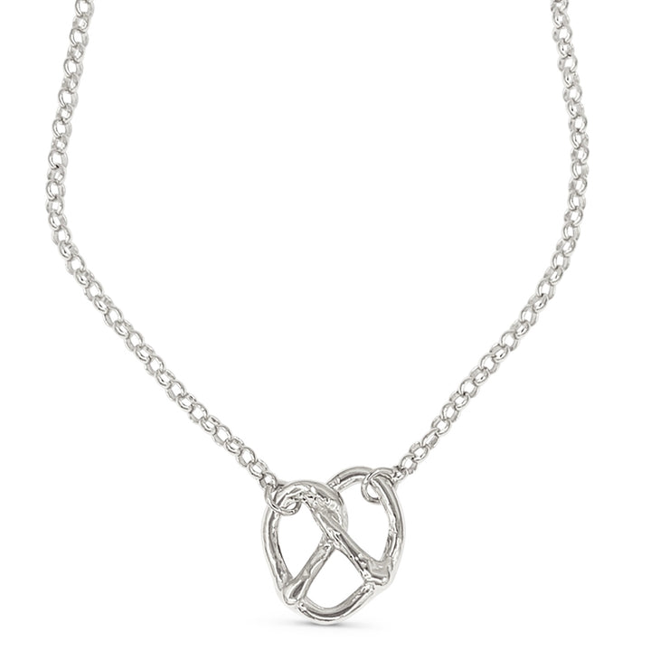 Silver necklace with a pretzel-shaped pendant on a white background