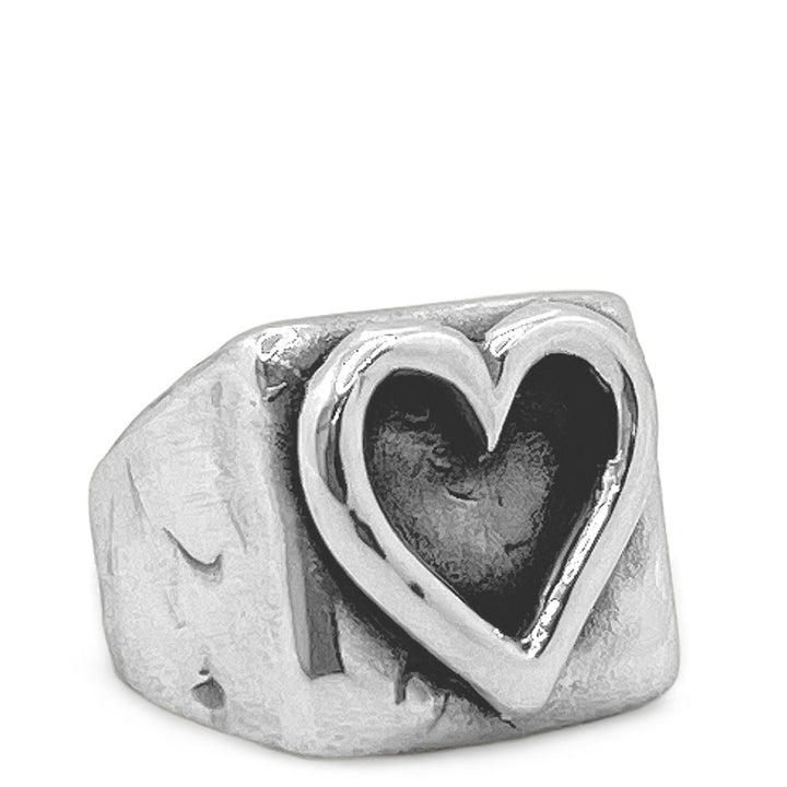 Silver ring with a heart-shaped design on a white background