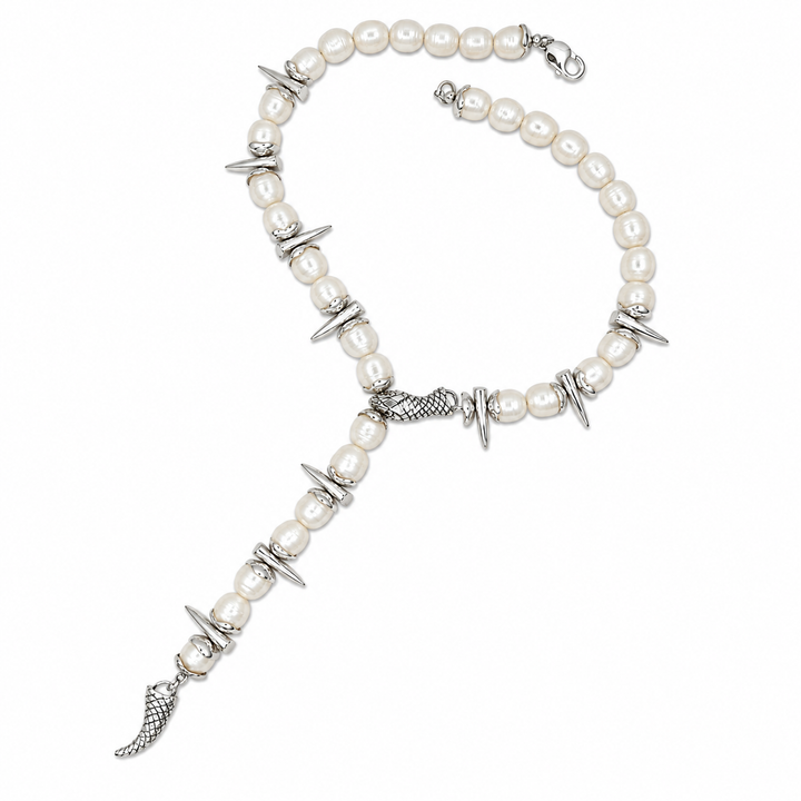A pearl and silver-tone beaded necklace with decorative metal accents, including pointed discs, textured links, and a dangling fish-shaped charm, shown on a plain white background.