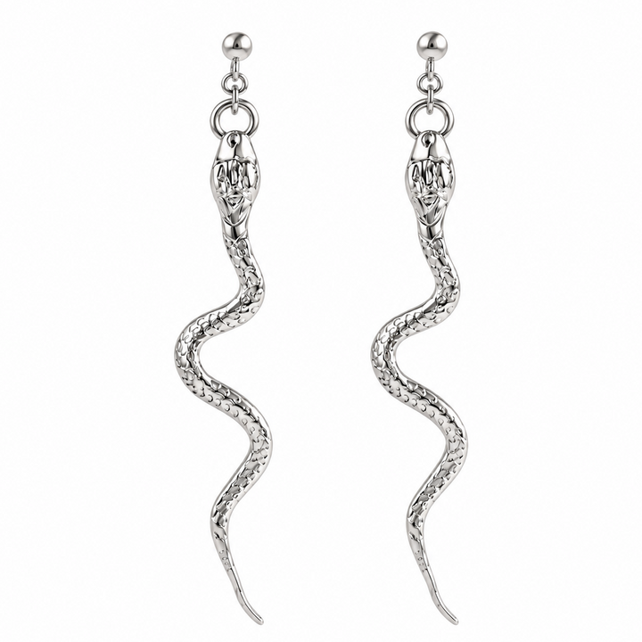 A pair of silver snake drop earrings with detailed scales and a textured body, hanging from small silver ball studs on a plain white background.