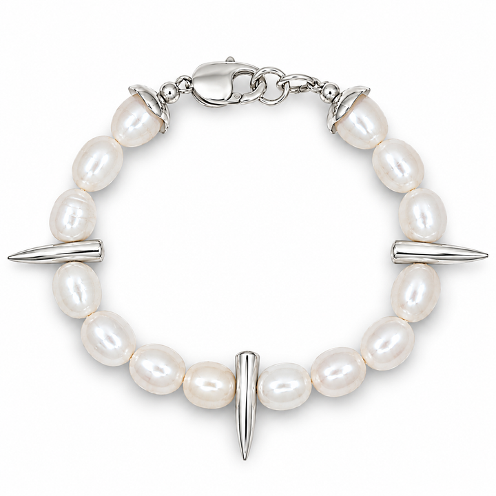 A silver-toned beaded bracelet featuring irregular white freshwater pearls, three polished spike charms, and a lobster clasp closure, shown on a clean white background.