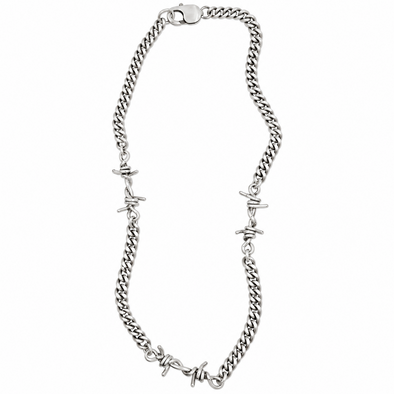 A silver-toned curb chain necklace featuring integrated barbed wire motifs at intervals, displayed on a clean white background.