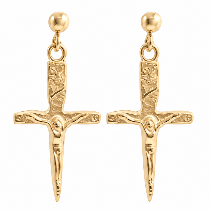 A pair of gold-tone drop earrings featuring a detailed crucifix pendant with a textured hilt, a figure of Jesus on the cross, and a round ball stud at the top, shown against a plain white background.