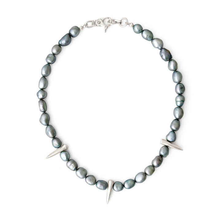 Necklace with gray beads and silver accents on a white background