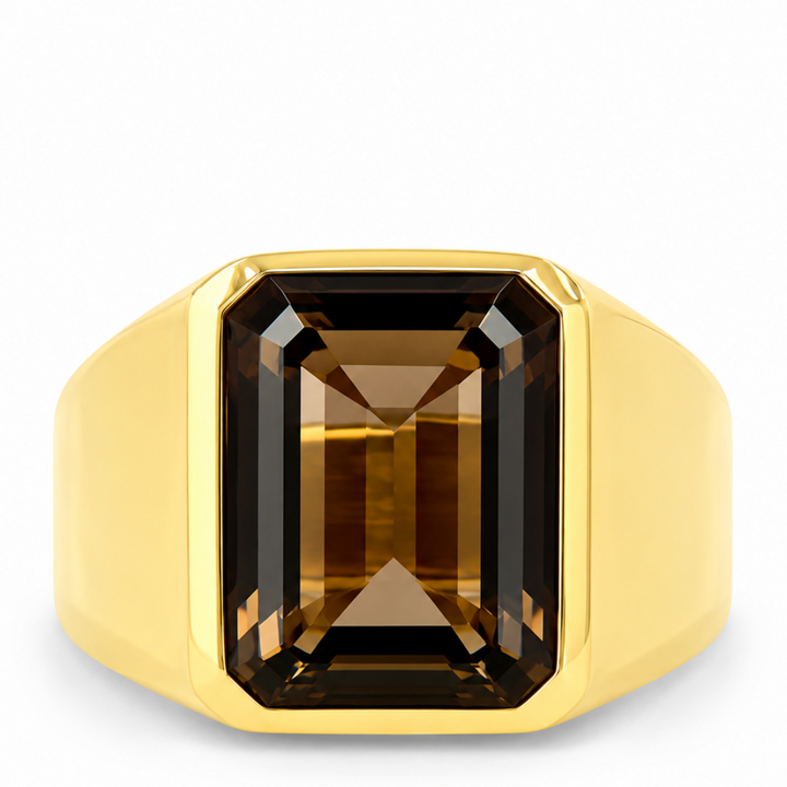 A yellow gold signet ring featuring a large, faceted rectangular emerald-cut brown gemstone, shown against a plain white background.