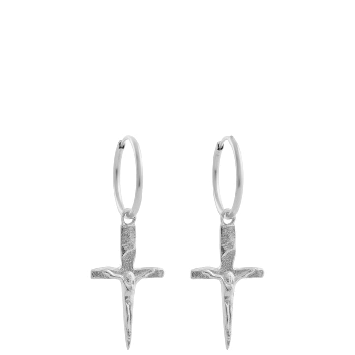 Silver cross earrings on a white background