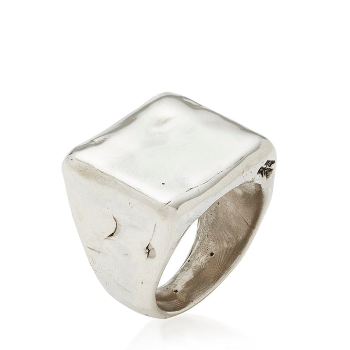 Silver ring with a textured surface on a white background