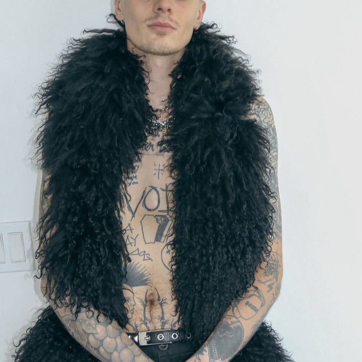 male model posing in white background wearing our mongolian lamb boa in black