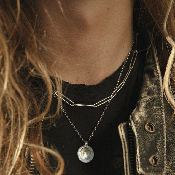 close up shot of neck with our liquid coin pendant