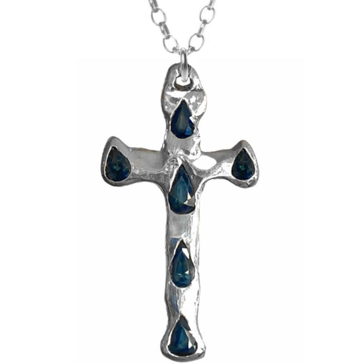Handmade Sterling Silver Argentium XL Cross set with six blue sapphires hanging from a hypoallergenic Sterling Silver Argentium rolo chain.