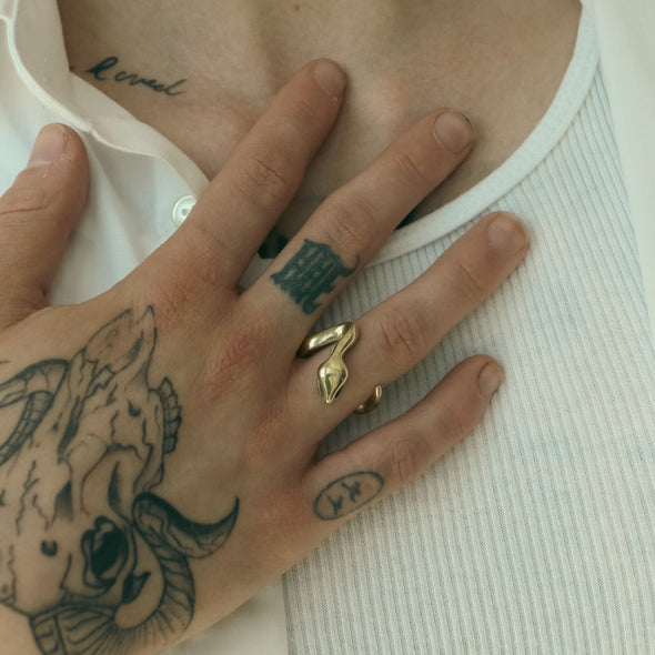 male model wearing our gold open snake ring