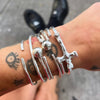 close up shot of wrist with our hammered crucifix cuff
