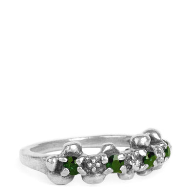 thin gemstone studded ring with four green garnet gemstones