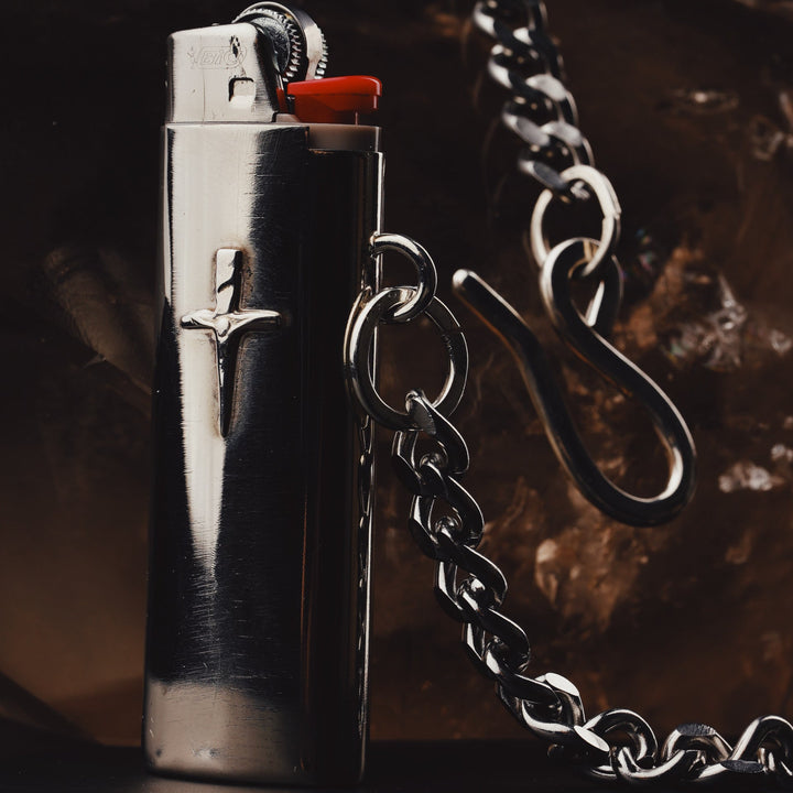 Standard bic Lighter sleeve made from nickel silver sheet, with Britt's handmade sterling Silver Crucifix Dagger pendant soldered onto it