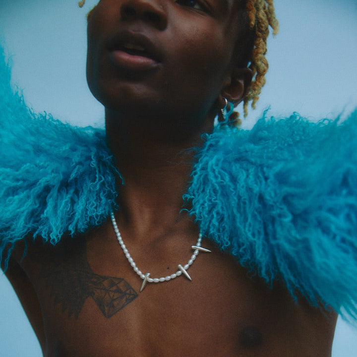 male model wearing our spike pearl necklace