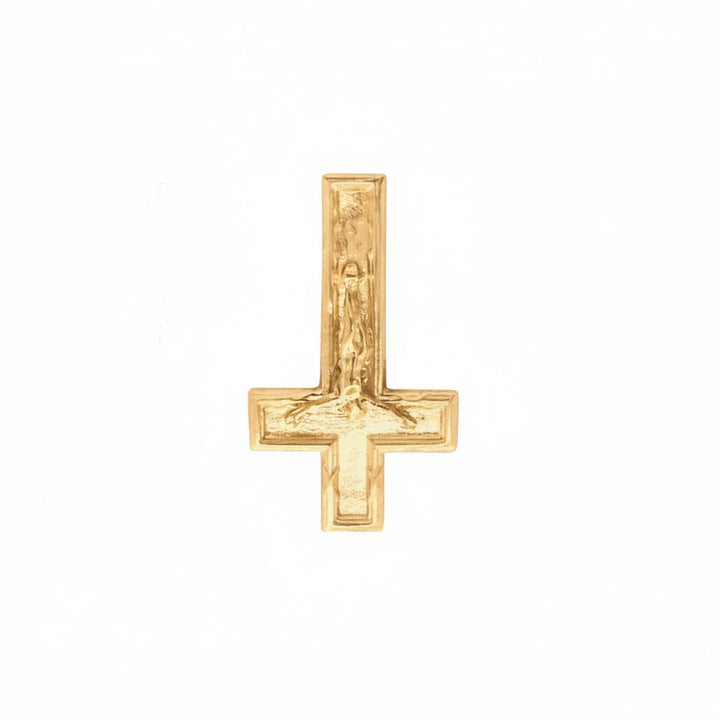 Gold cross pendant on a white background