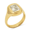 A hand carved smooth & glossy signet style ring with a bubbly feel, cast in 14k Yellow Gold with an Emerald cut Lab grown Diamond.