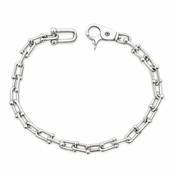 A silver-toned metal chain bracelet with alternating polished round beads and elongated links, shown on a plain white background.