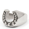 Silver Horse shoe ring with studs on a white background