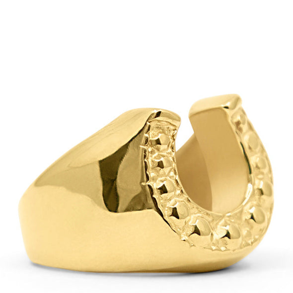 Gold ring shaped like a horseshoe on a white background