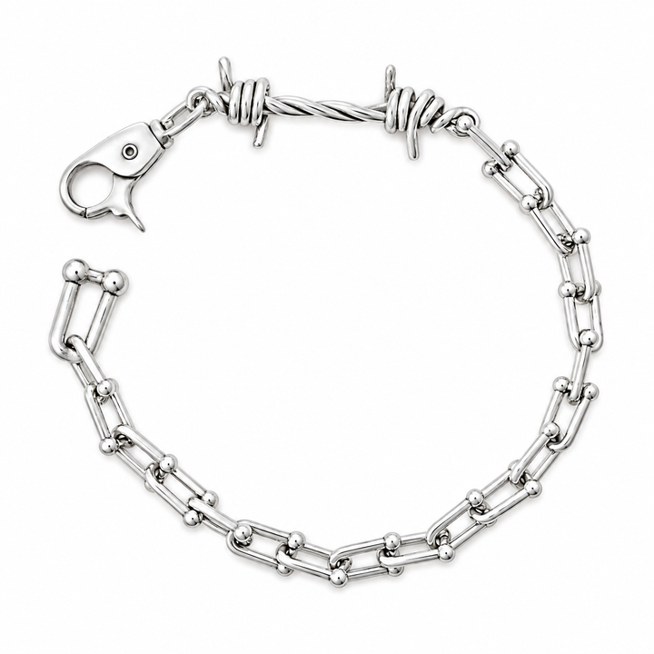 A silver-toned metal bracelet featuring alternating elongated oval links and twisted barbed wire links, with a lobster clasp closure, shown on a plain white background.