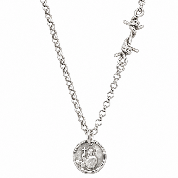 A silver chain necklace featuring a round medallion pendant with a raised figure and a barbed wire clasp closure, shown against a plain white background.