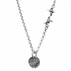 Silver necklace with a round pendant on a white background