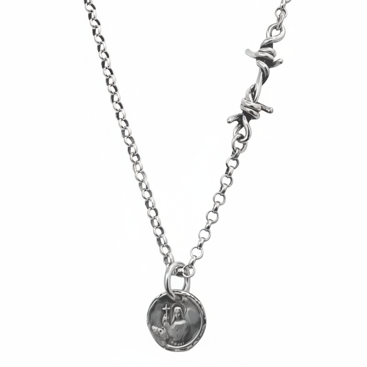 Silver necklace with a round pendant on a white background
