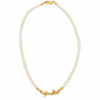 A delicate necklace made of small white pearls with gold-toned metal accents, including a lobster clasp and a decorative barbed wire style charm, shown on a plain white background.