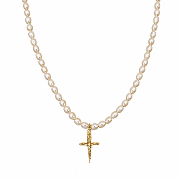 A pearl necklace with a textured gold crucifix pendant, displayed against a solid white background.