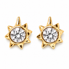 A pair of gold sunburst stud earrings with a clear round-cut gemstone in the center, set against a plain white background.