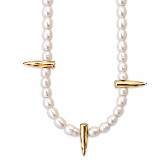 A pearl necklace with three gold spike charms, displayed on a clean white background.