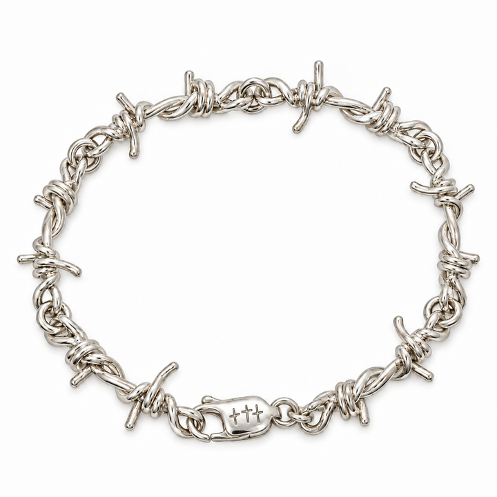 A silver barbed wire bracelet with a lobster clasp, displayed on a clean white background.