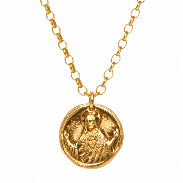 A gold chain necklace featuring a round, textured gold pendant with an embossed figure, shown against a plain white background.
