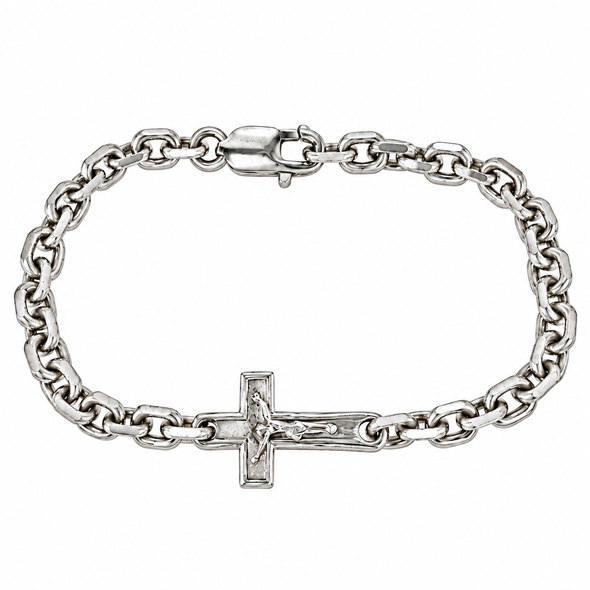 A silver-toned chain bracelet featuring a detailed crucifix pendant with a raised figure of Jesus, displayed on a clean white background.