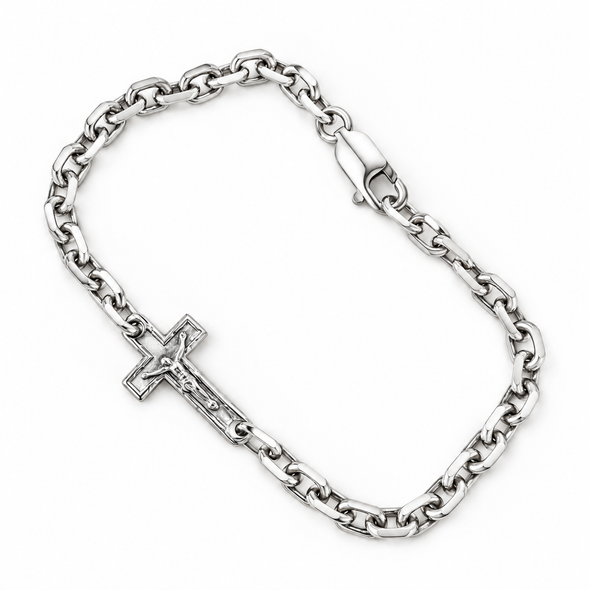 A silver-toned chain bracelet with a crucifix pendant, displayed on a clean white background.