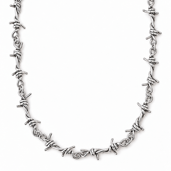 A silver-toned metal necklace featuring a continuous barbed wire design, displayed against a solid white background.