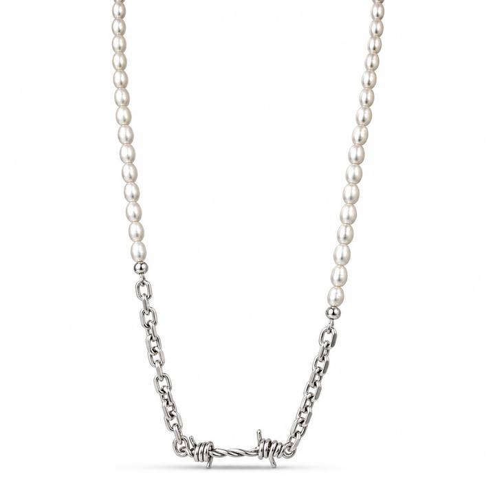 A silver necklace featuring a strand of white pearls transitioning into a barbed wire pendant, shown against a plain white background.